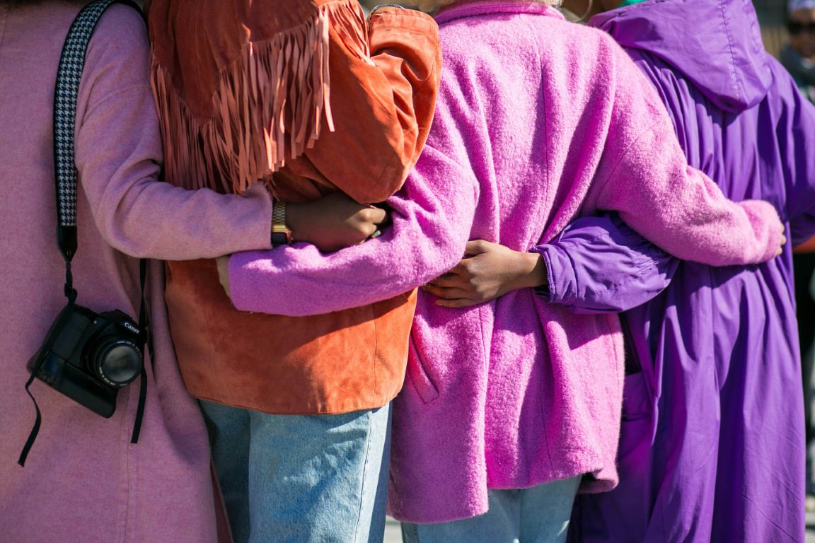 People standing together in bright clothing